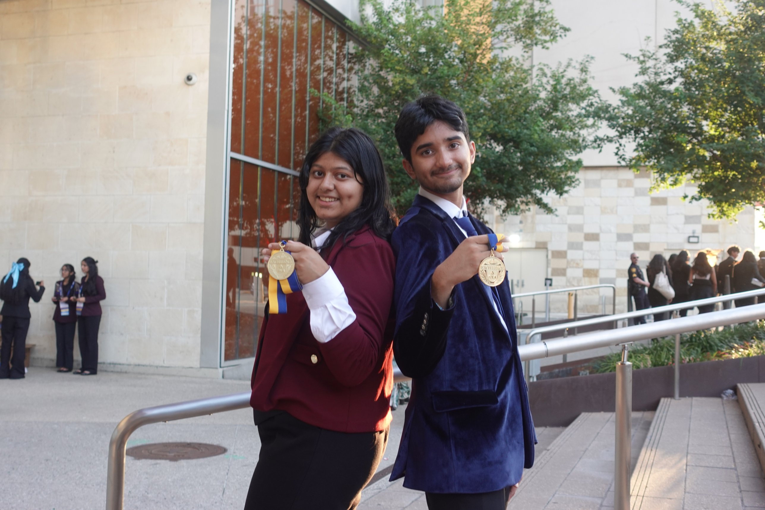 Sufee Kathane and a teammate holding up their FBLA medals