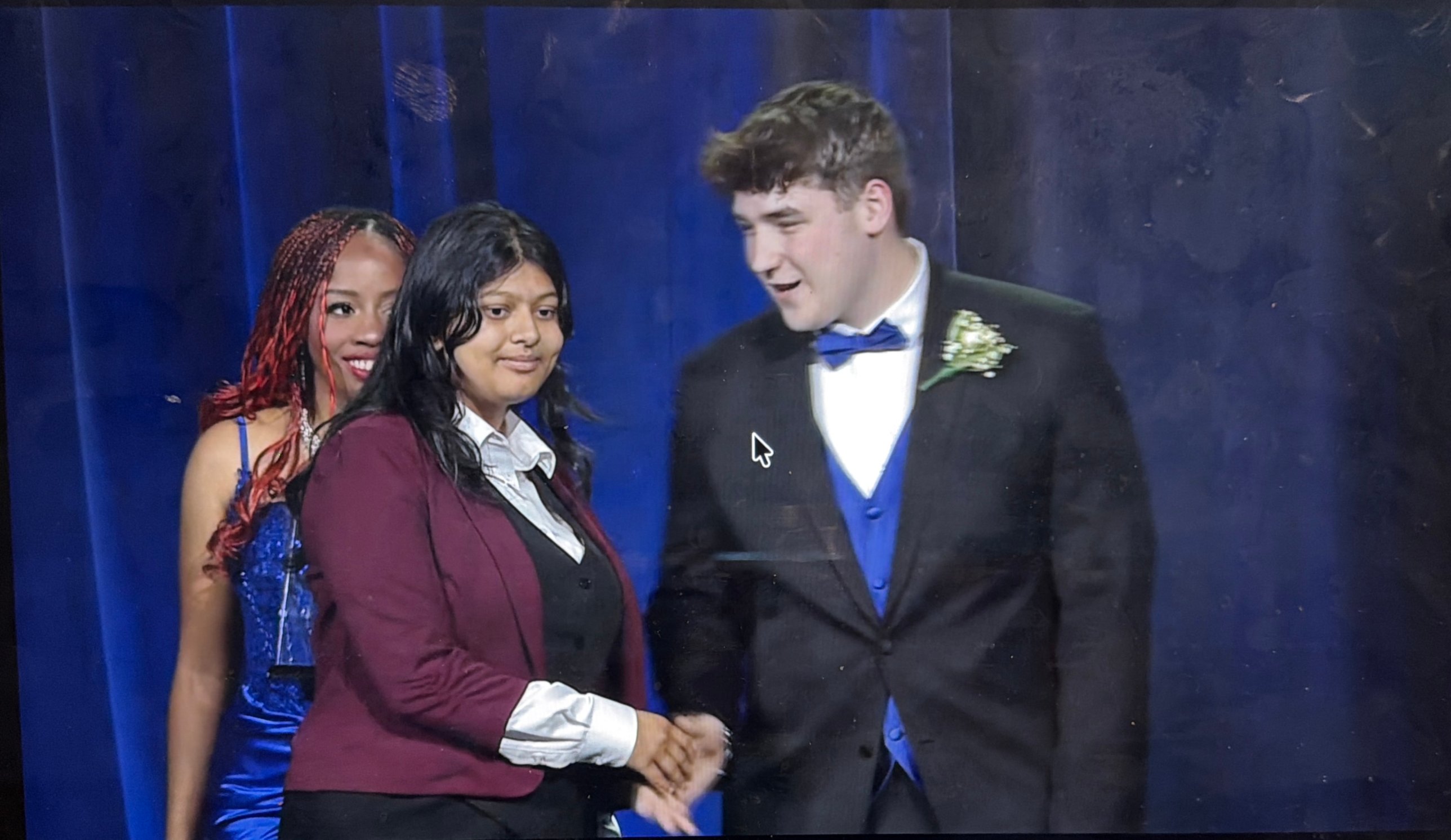 Sufee Kathane on stage receiving an FBLA award